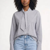 Elegante gestreepte damesblouse met volant en lange mouwen