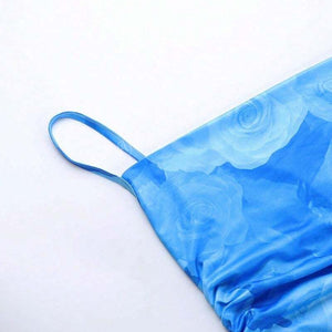 Lang zomerjurk met aquarelprint en spaghettibandjes