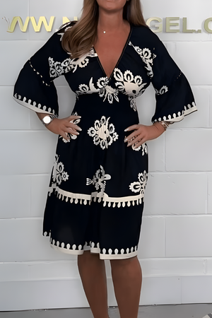 Elegante jurk met patroon en V-hals – perfect voor elke gelegenheid