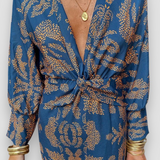Elegante midi-jurk met twist-detail en bloemmotief – Tijdloos en stijlvol