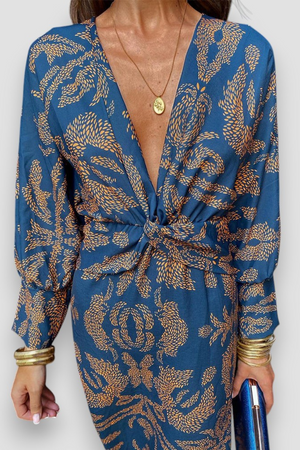 Elegante midi-jurk met twist-detail en bloemmotief – Tijdloos en stijlvol