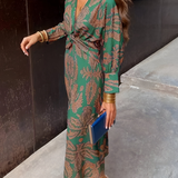 Elegante midi-jurk met twist-detail en bloemmotief – Tijdloos en stijlvol