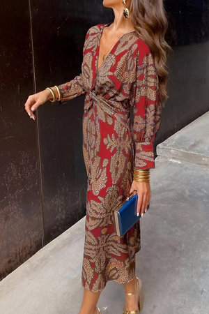 Elegante midi-jurk met twist-detail en bloemmotief – Tijdloos en stijlvol