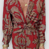 Elegante midi-jurk met twist-detail en bloemmotief – Tijdloos en stijlvol