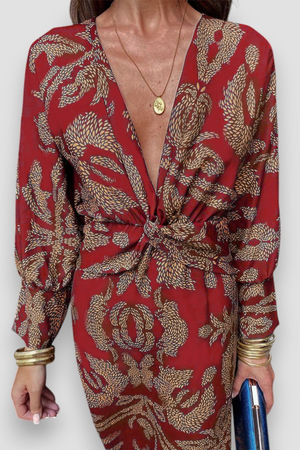 Elegante midi-jurk met twist-detail en bloemmotief – Tijdloos en stijlvol
