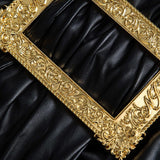 Lyra | Figuuraccentuerende Kunstlederen Minirok met asymmetrische Drapering en gouden Decoratiespeld