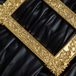 Lyra | Figuuraccentuerende Kunstlederen Minirok met asymmetrische Drapering en gouden Decoratiespeld