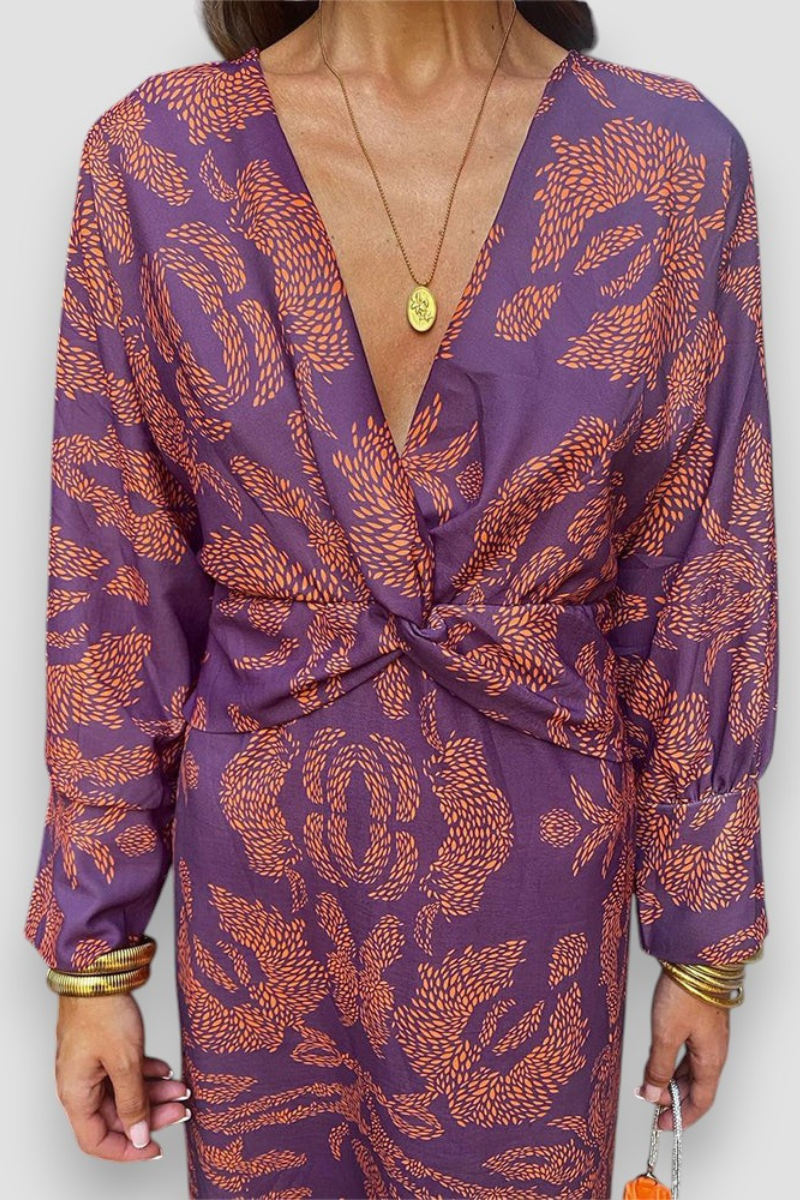 Elegante midikleid met twist-detail en bloemmotief – Tijdloos en stijlvol