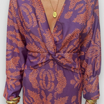 Elegante midikleid met twist-detail en bloemmotief – Tijdloos en stijlvol