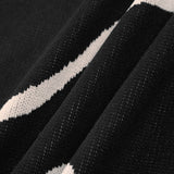 Maisie | Figuuraccentuerende midijurk met abstract patroon en delicate spaghettibandjes