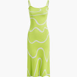 Maisie | Figuuraccentuerende midijurk met abstract patroon en delicate spaghettibandjes