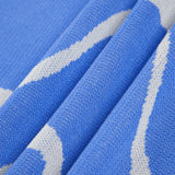Maisie | Figuuraccentuerende midijurk met abstract patroon en delicate spaghettibandjes