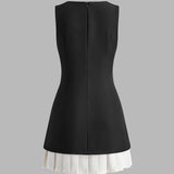 Robin | Elegante mouwloze midikleed met plissé-design