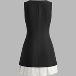 Robin | Elegante mouwloze midikleed met plissé-design