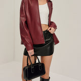 Bordeauxrode Kunstlederjacke