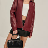Bordeauxrode Kunstlederjacke