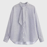 Elegante gestreepte damesblouse met volant en lange mouwen