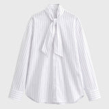 Elegante gestreepte damesblouse met volant en lange mouwen