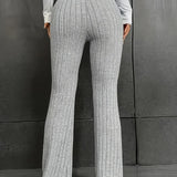 Dames broek – hoge taille slim fit met flared pijp & geribbelde stretchstof