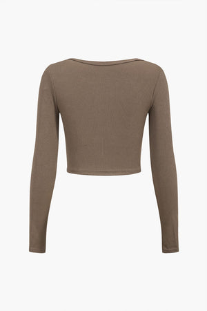 Amira | Asymmetrisch Langarmtop met Cut-Out & Knopdetails