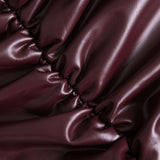 Jocasta | Figuuraccentuerende Kunstlederen Minirok met Zijdelingse Rimpeling en Asymmetrische Zoom