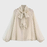 Elegante damesblouse met stippen en strik, lange mouwen